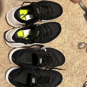 2 pair of Nike training sneakers.